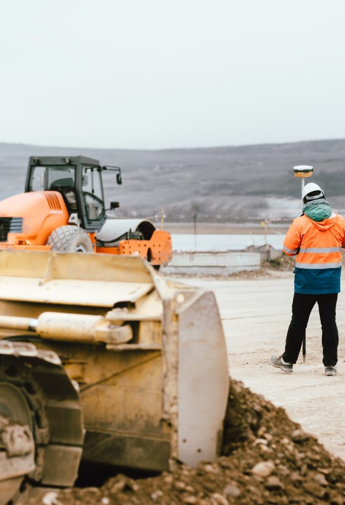 surveyor-engineer-with-gps-system-outdoors-at-highway-construction-site.jpg